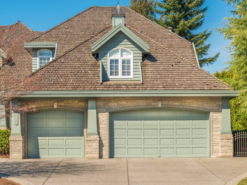 Fragment of a luxury house with a garage door in Vancouver, Canada. Horizontal orientation.